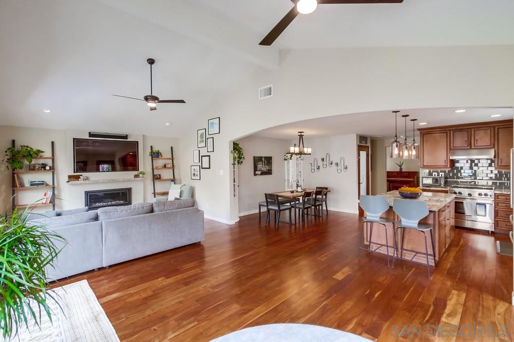 12128 Eagle Street San Diego, CA 92131 - Photo 7 of 37 a living room with furniture wooden floor and a flat screen tv
