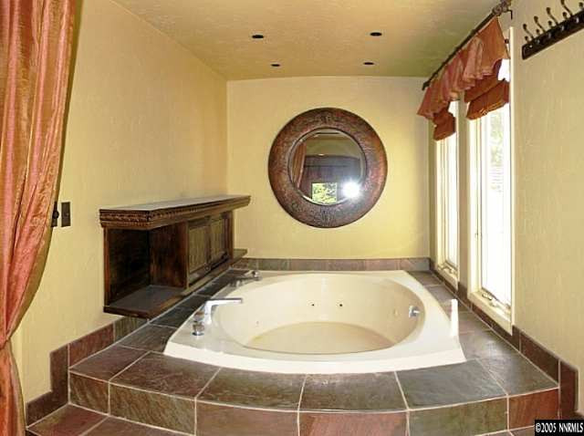 1620 Belford Road Reno, NV 89509 - Photo 7 of 9 a bathroom with a sink and a mirror