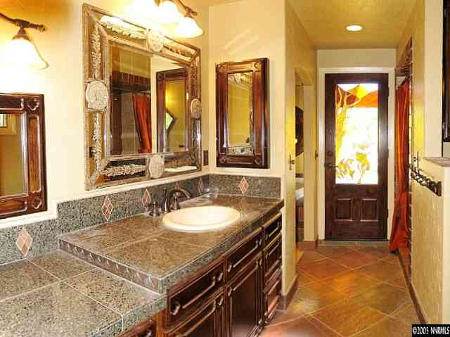 1620 Belford Road Reno, NV 89509 - Photo 9 of 9 a bathroom with a granite countertop sink and a mirror