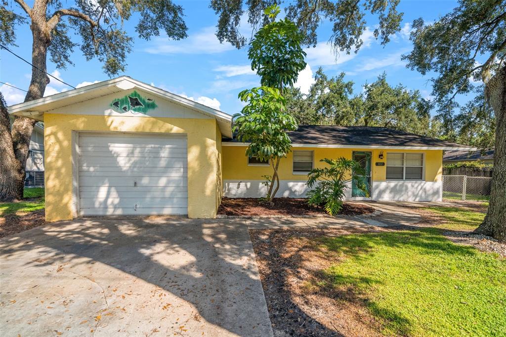 9217 Maynard Avenue New Port Richey, FL 34654 - Photo 1 of 1 a view of a house with a yard
