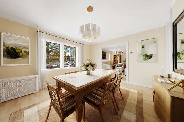 a living room with furniture a fireplace and a chandelier