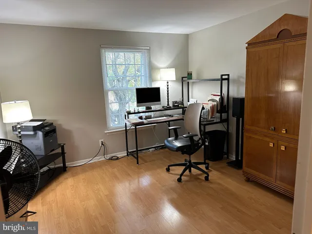 a bed room with a bed window and a chair