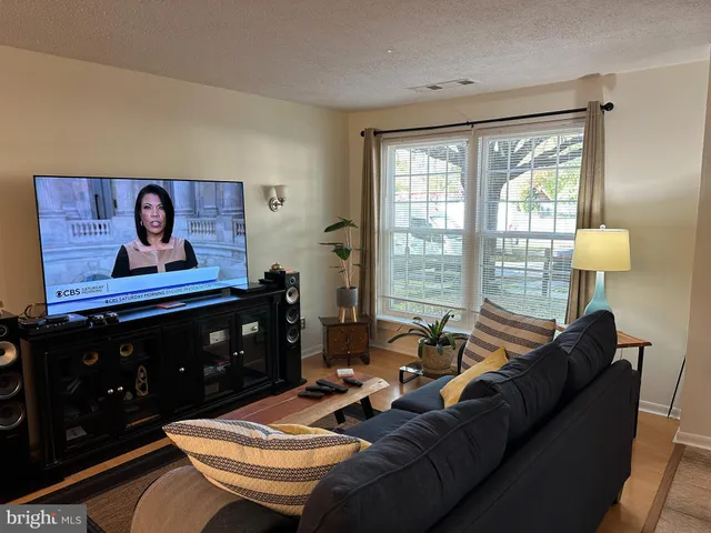 a view of a dining room with furniture and a rug