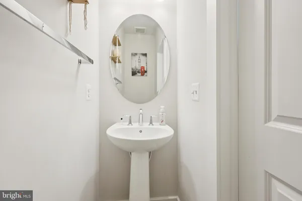 a bathroom with a sink and mirror