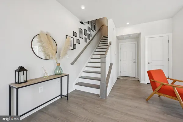 a view of an entryway with wooden floor