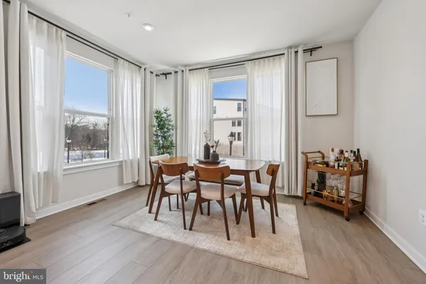 a dining room with furniture window wooden floor