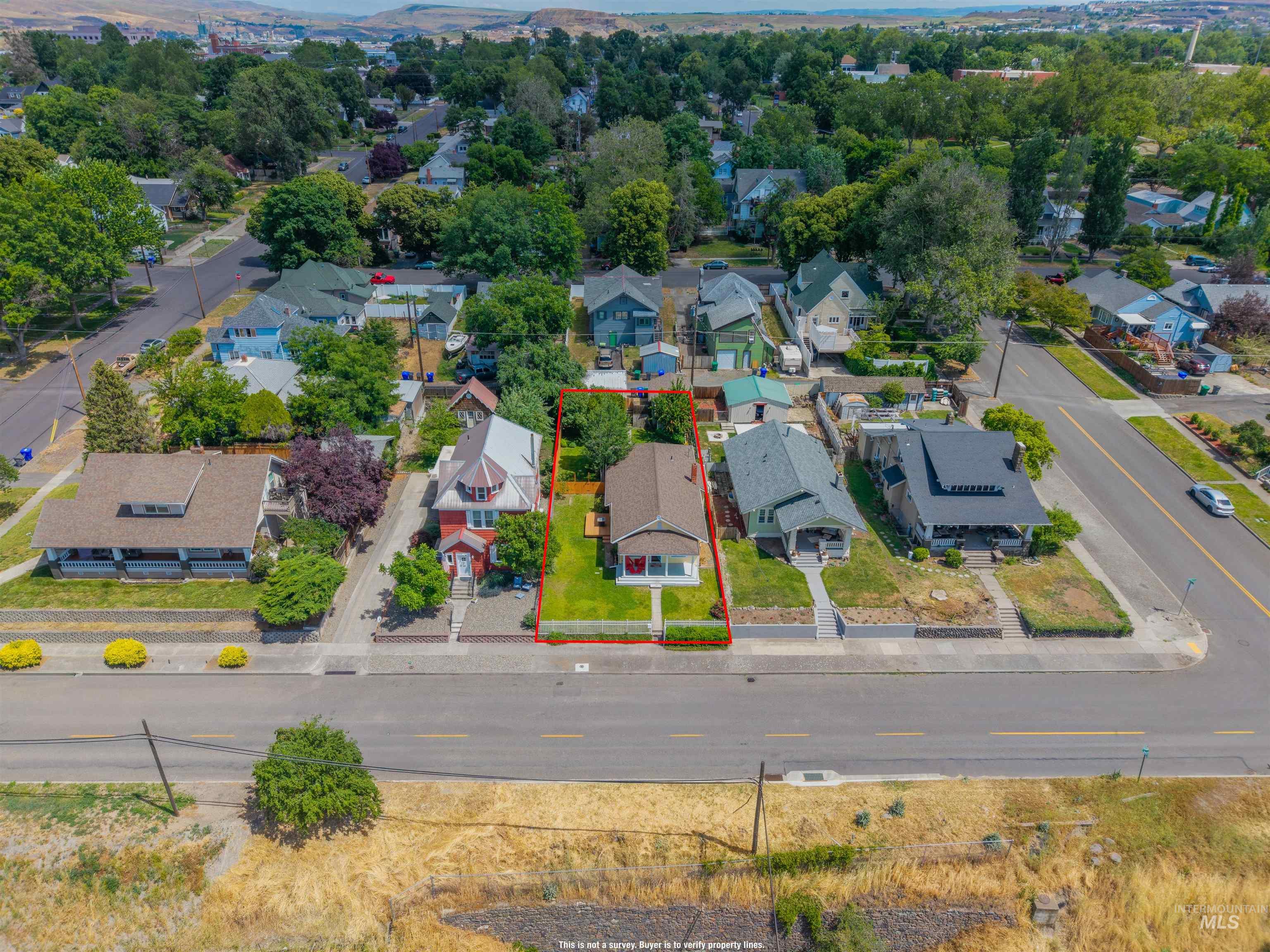 619 Prospect Avenue Lewiston, ID 83501 - Photo 35 of 37 Aerial view of a residential property with a gabled roof and a front lawn