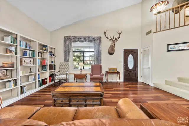 a view of a dining room with furniture wooden floor and chandelier