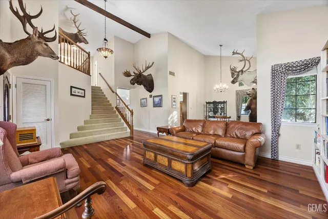 a living room with furniture fireplace and a table