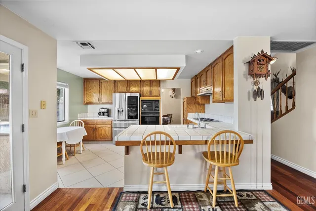 a view of an entryway with wooden floor