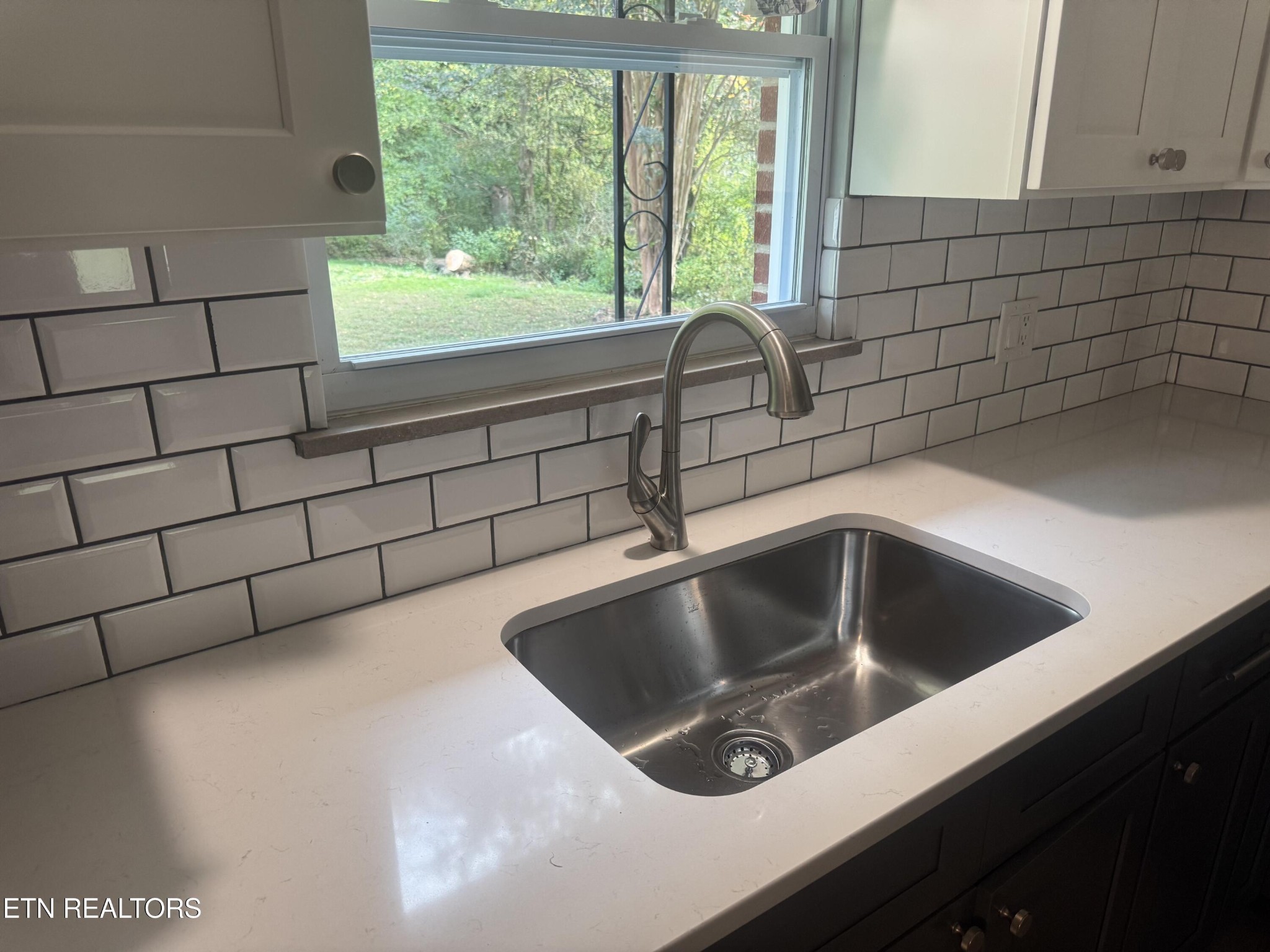 3341 West Wolf Valley Road Clinton, TN 37716 - Photo 12 of 41 a kitchen with a sink and large window