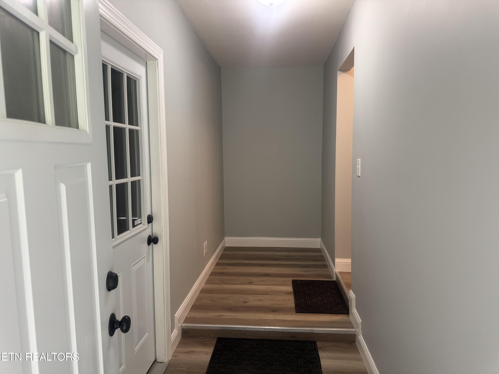 3341 West Wolf Valley Road Clinton, TN 37716 - Photo 19 of 41 a view of a hallway with wooden floor and entryway