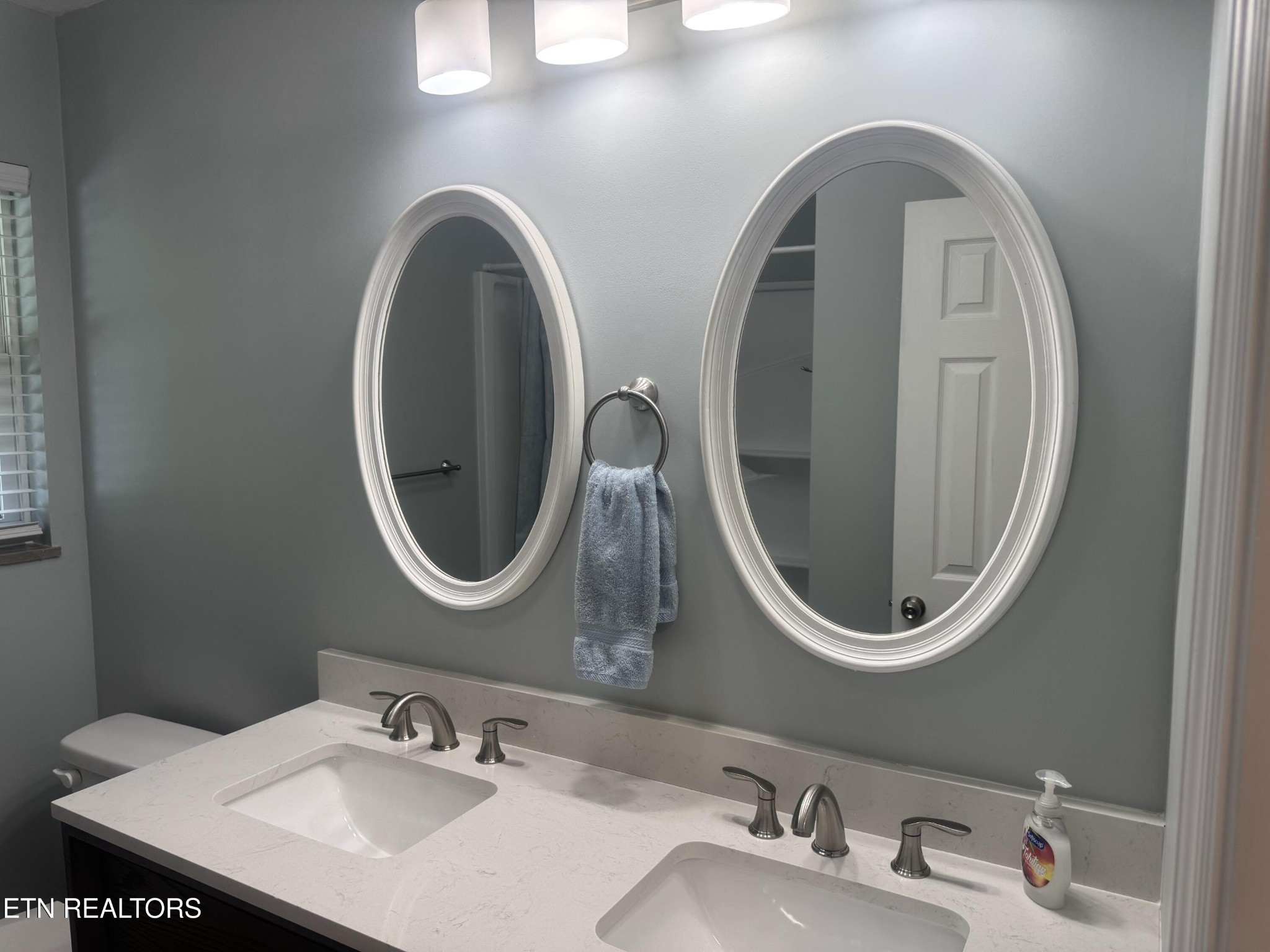 3341 West Wolf Valley Road Clinton, TN 37716 - Photo 25 of 41 a bathroom with a granite countertop double vanity sinks and a mirror