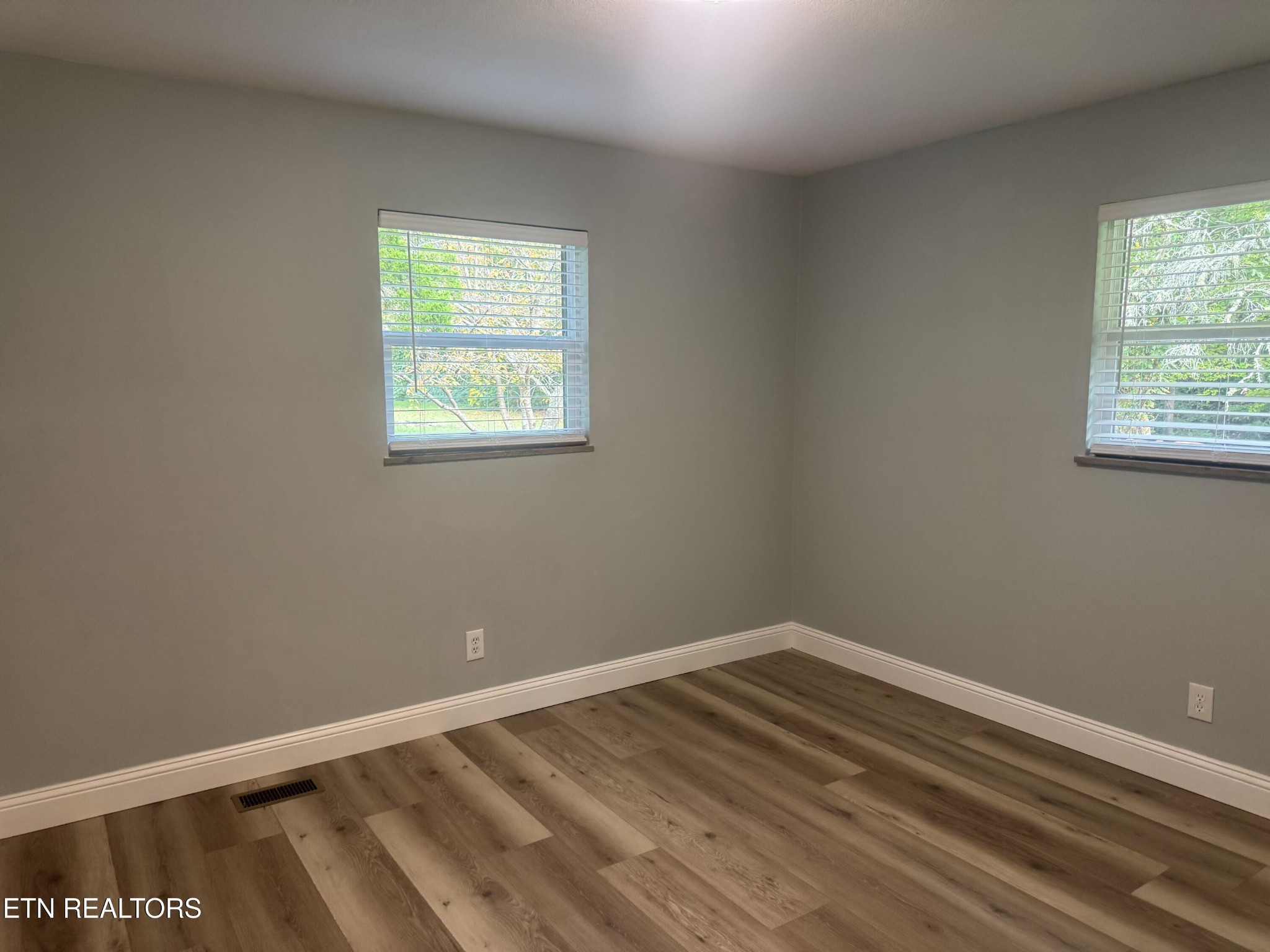 3341 West Wolf Valley Road Clinton, TN 37716 - Photo 30 of 41 wooden floor in an empty room with a window