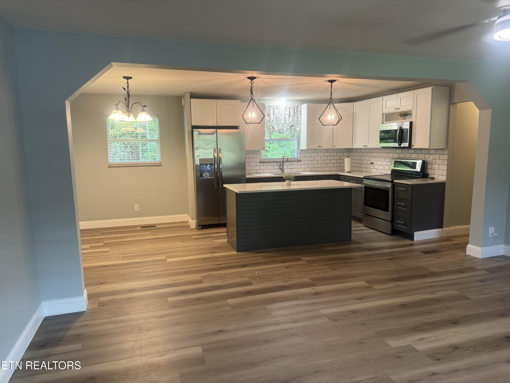 3341 West Wolf Valley Road Clinton, TN 37716 - Photo 8 of 41 a view of kitchen with stainless steel appliances granite countertop a stove and a refrigerator