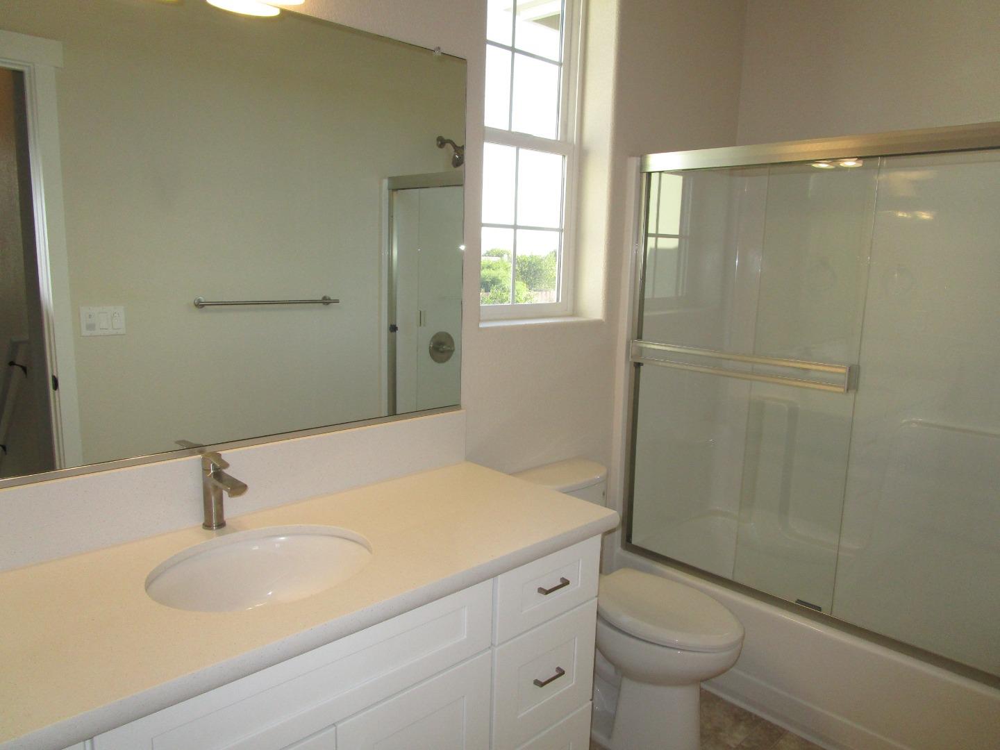 159 Terrace Drive Greenfield, CA 93927 - Photo 15 of 23 a bathroom with a sink toilet and shower