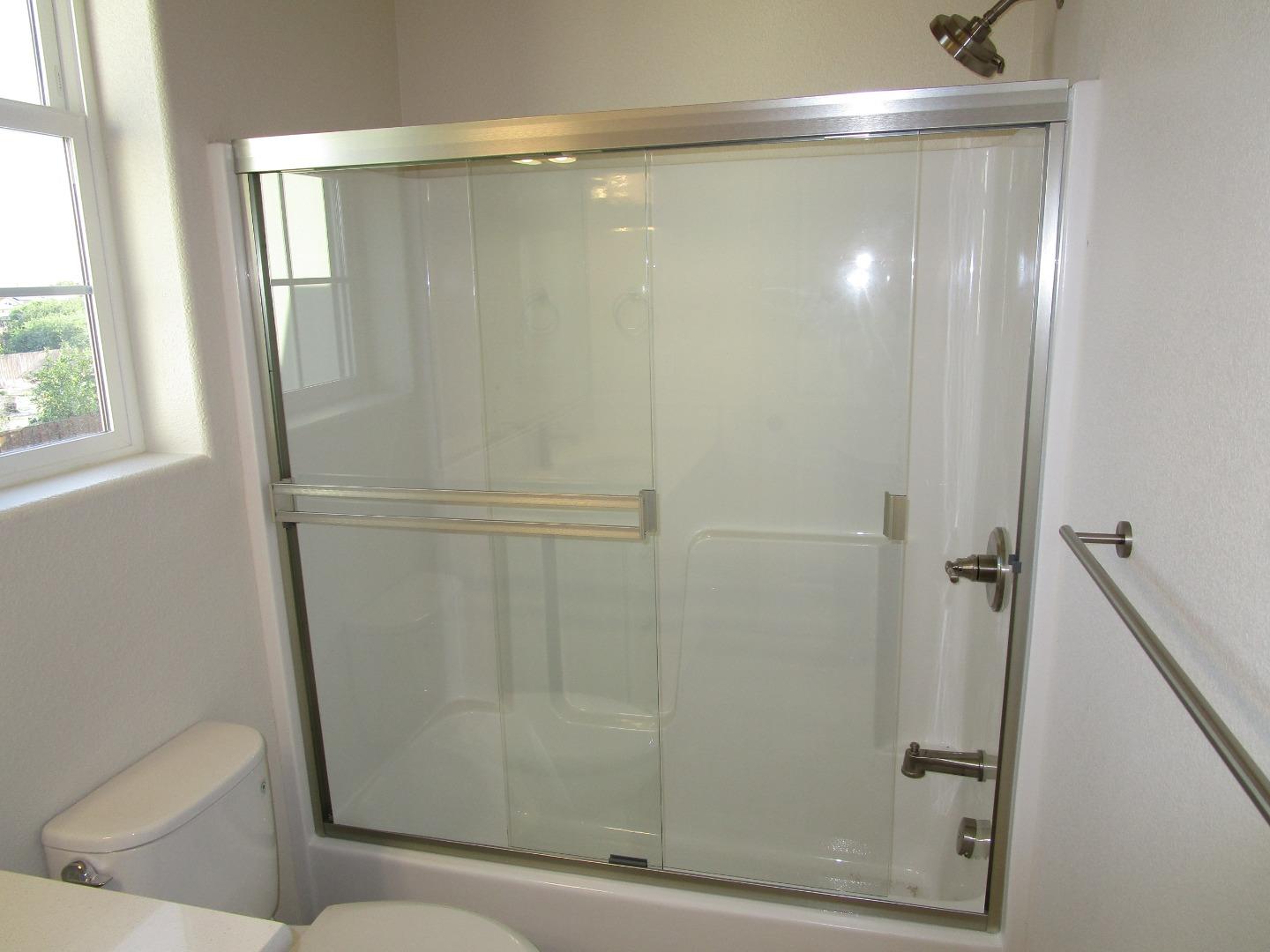 159 Terrace Drive Greenfield, CA 93927 - Photo 16 of 23 a bathroom with a glass shower door