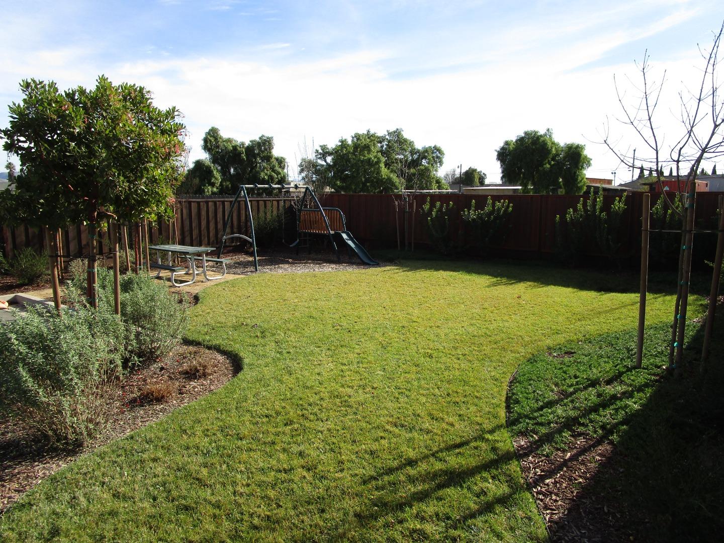 159 Terrace Drive Greenfield, CA 93927 - Photo 21 of 23 a view of a garden with wooden fence