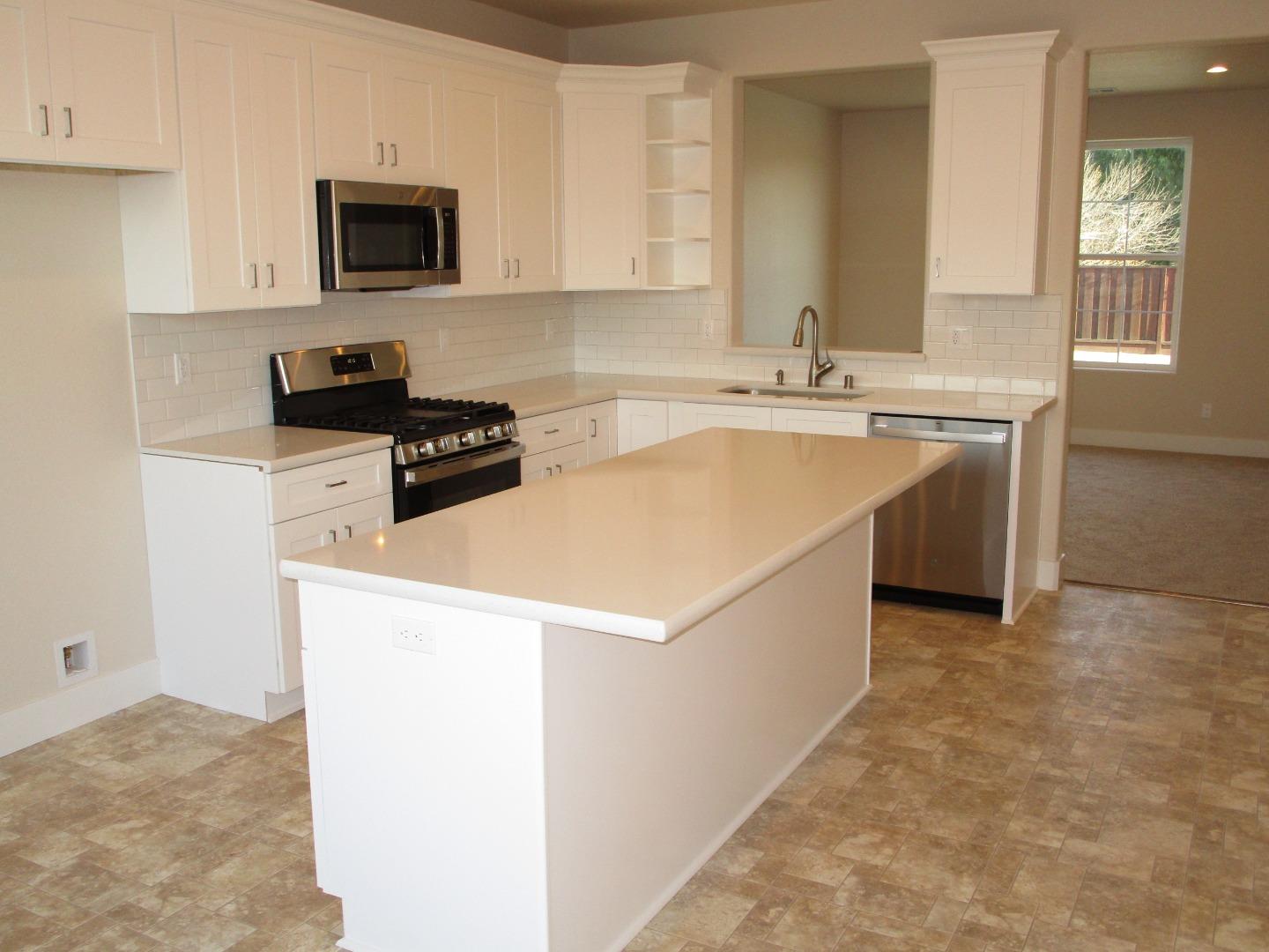 159 Terrace Drive Greenfield, CA 93927 - Photo 5 of 23 a kitchen with a sink stove and microwave