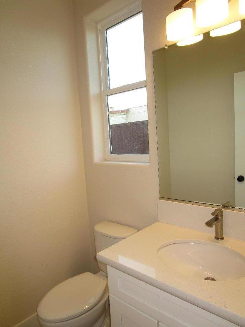 159 Terrace Drive Greenfield, CA 93927 - Photo 8 of 23 a bathroom with a sink a toilet and a window