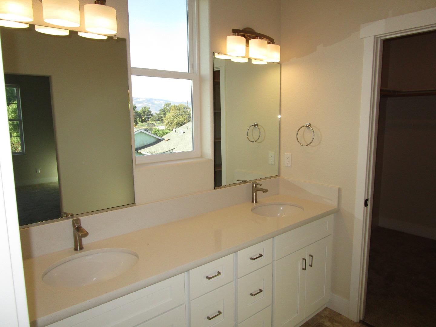 159 Terrace Drive Greenfield, CA 93927 - Photo 10 of 23 a bathroom with a sink double vanity and mirror