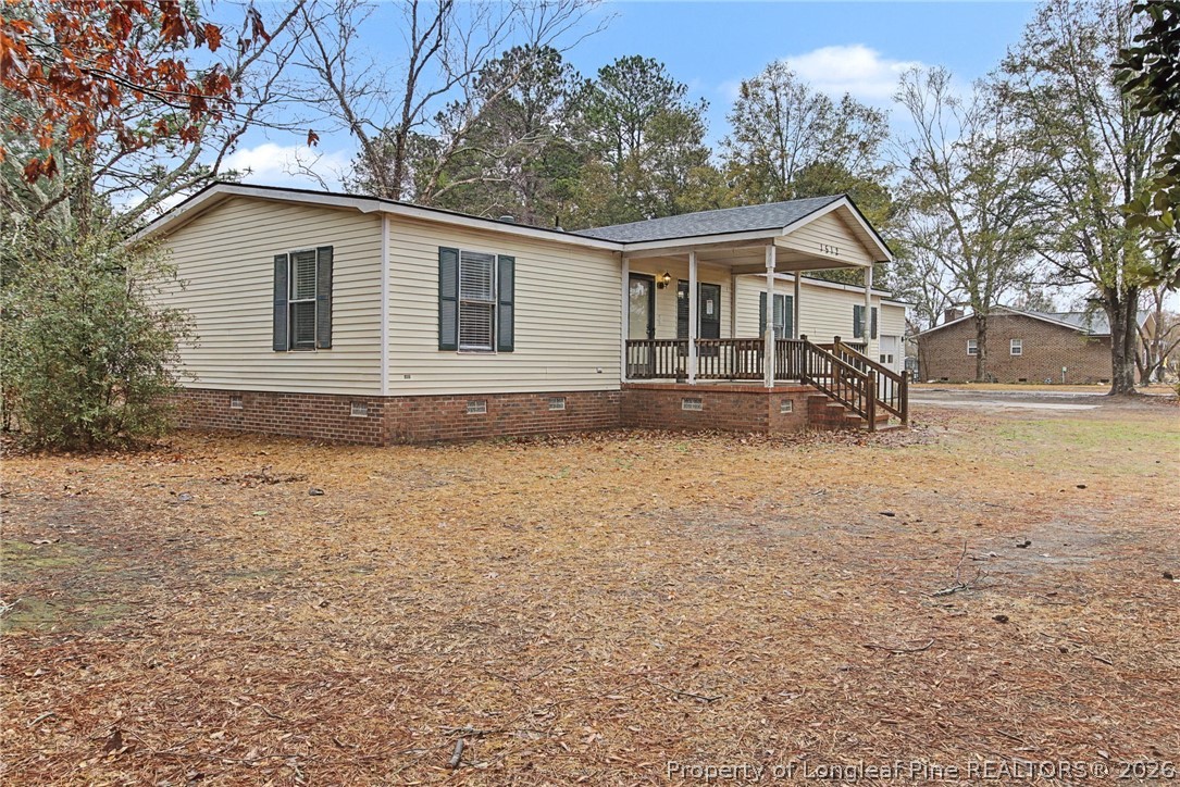1512 Seabrook School Road Fayetteville, NC 28312 - Photo 2 of 30 a front view of house with yard and trees around