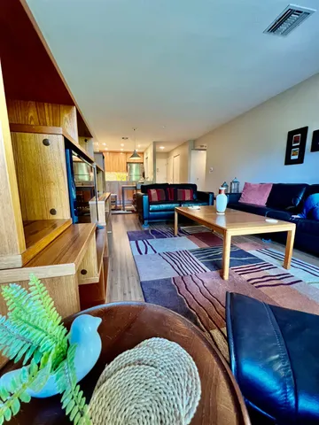 a living room with furniture and a rug