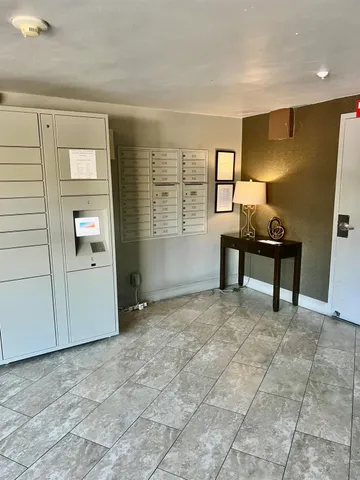 a view of a patio with chairs and a table