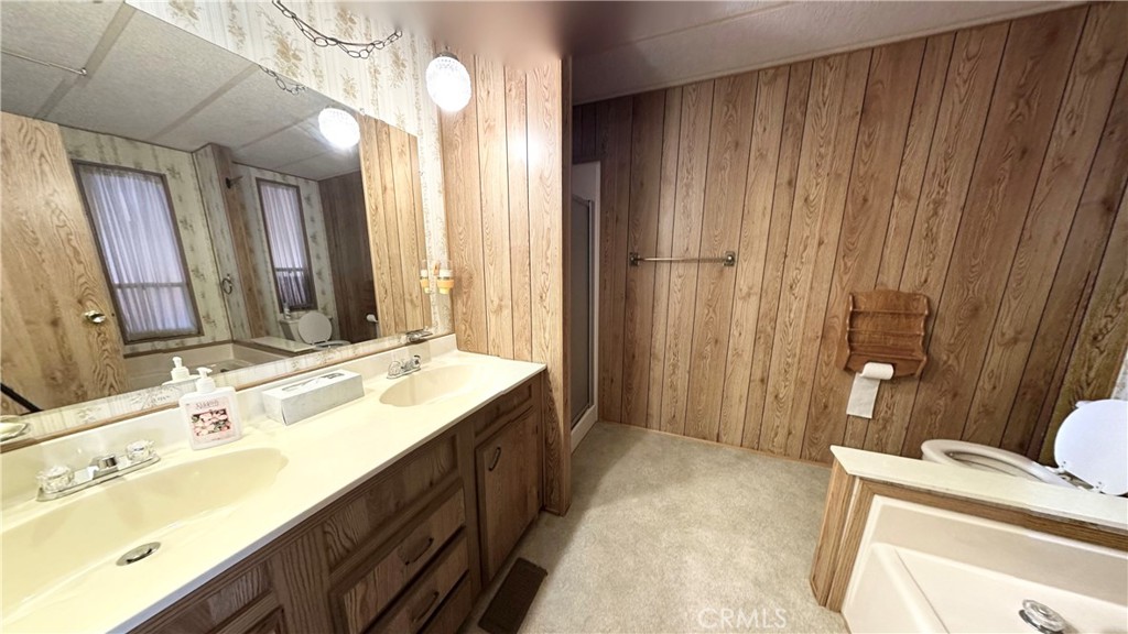2843 Lakeview Drive Nice, CA 95464 - Photo 13 of 20 a spacious bathroom with a double vanity sink a mirror and a bathtub
