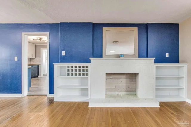 an open kitchen with a sink and a cabinet