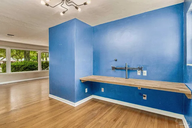 a view of room with cabinet and a window