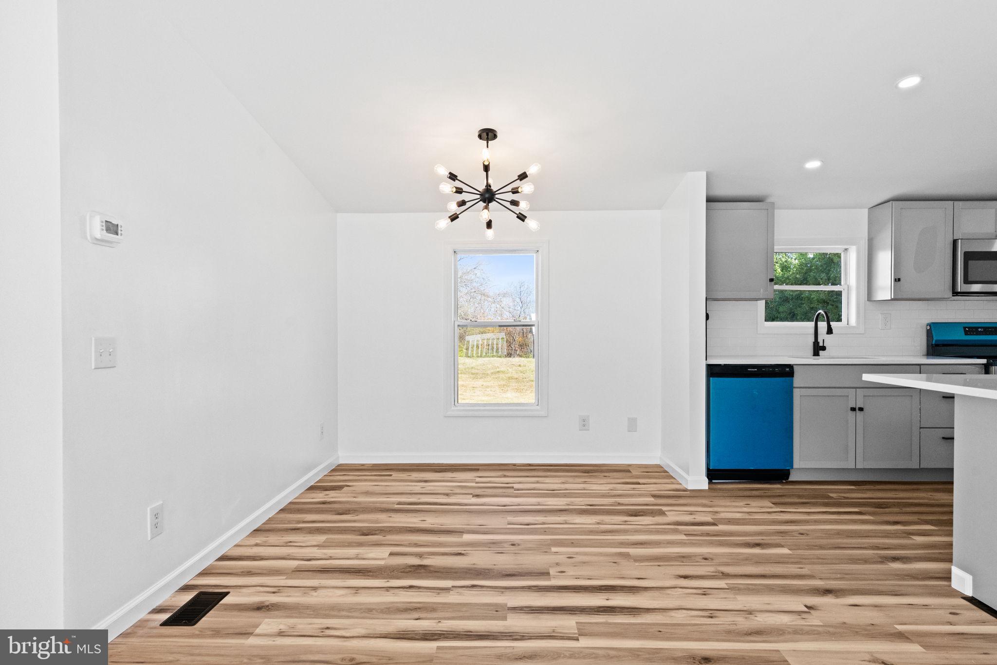 2337 Brownsville Road Robesonia, PA 19551 - Photo 14 of 57 a view of a kitchen with a sink cabinets and wooden floor