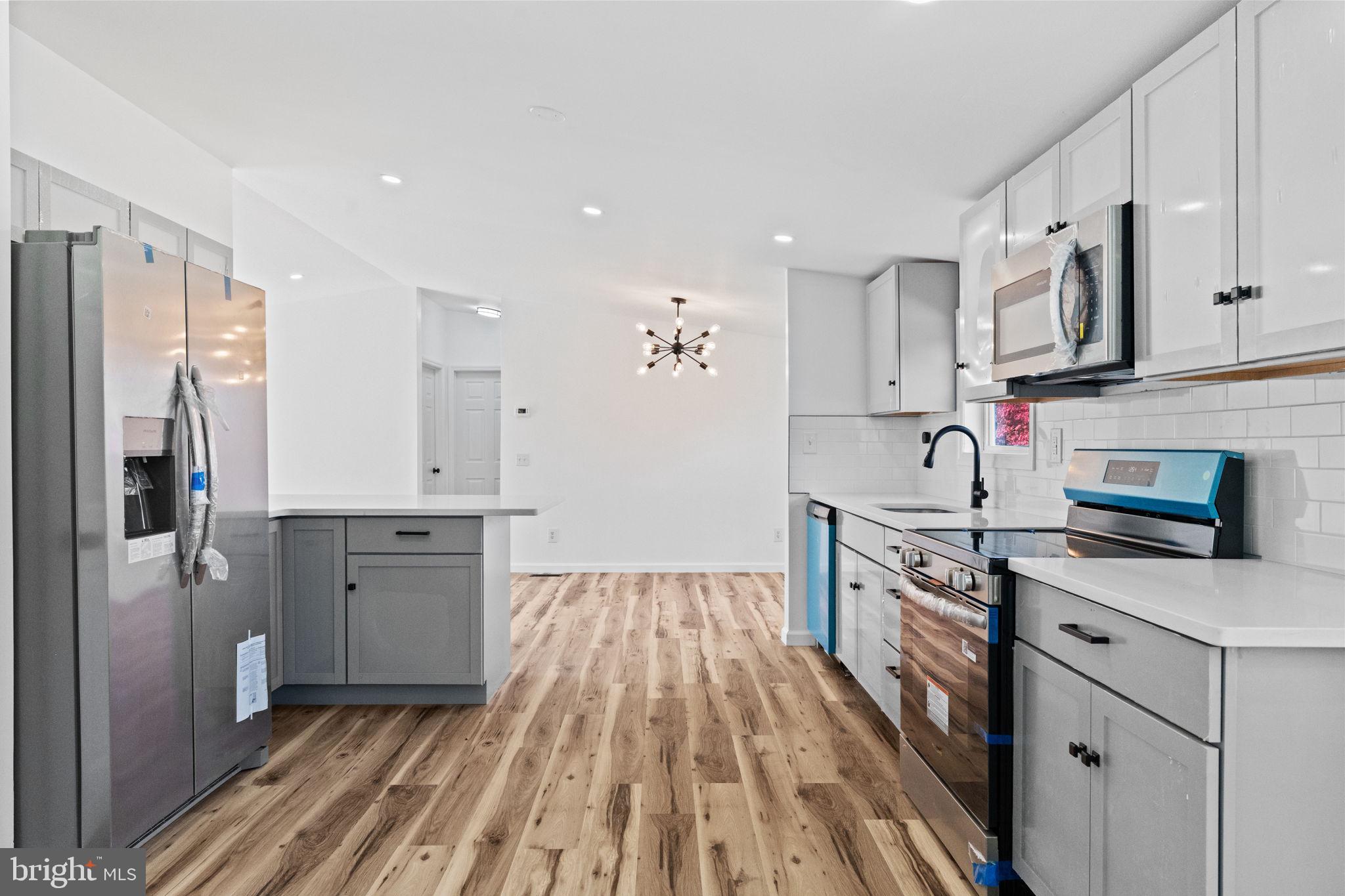 2337 Brownsville Road Robesonia, PA 19551 - Photo 23 of 57 a kitchen with stainless steel appliances granite countertop a refrigerator stove and sink