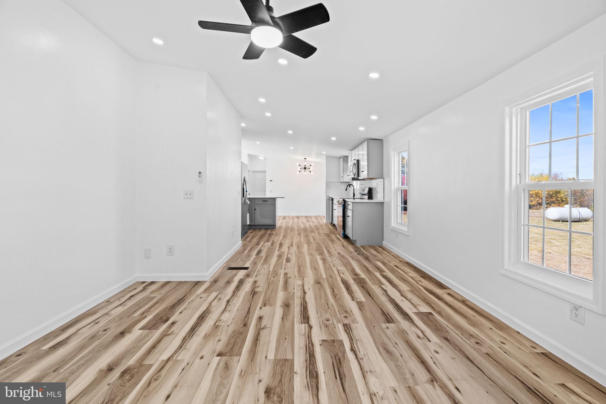2337 Brownsville Road Robesonia, PA 19551 - Photo 27 of 57 a view of a kitchen with a sink and dishwasher a refrigerator with wooden floor