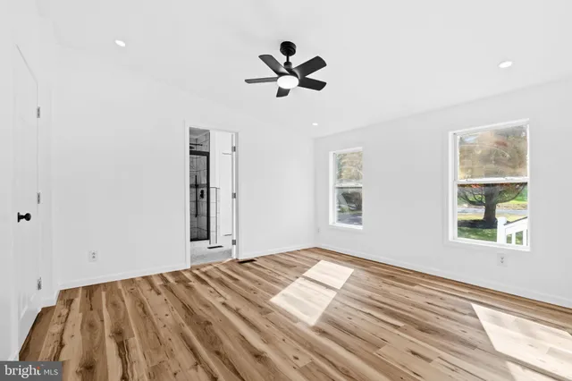 a view of an empty room with stairs