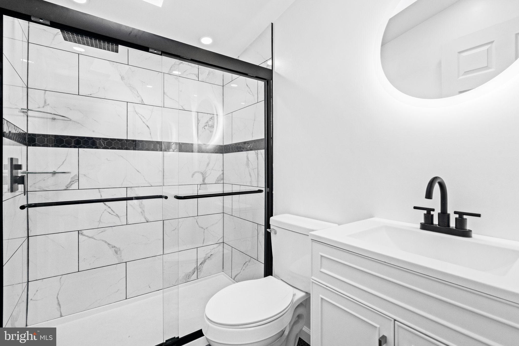 2337 Brownsville Road Robesonia, PA 19551 - Photo 46 of 57 a bathroom with a sink a toilet and shower