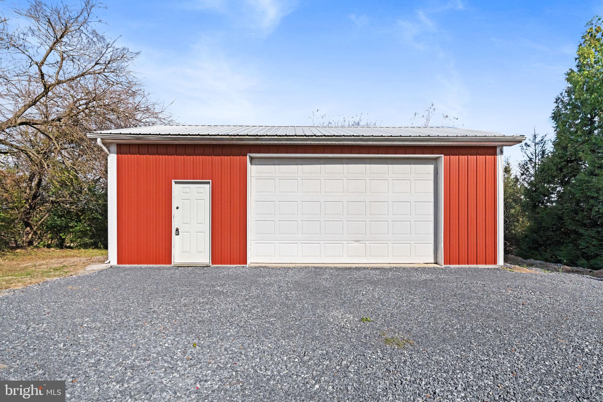 2337 Brownsville Road Robesonia, PA 19551 - Photo 49 of 57 a front view of a house with a yard and garage