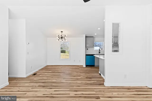 a view of a kitchen and an entryway