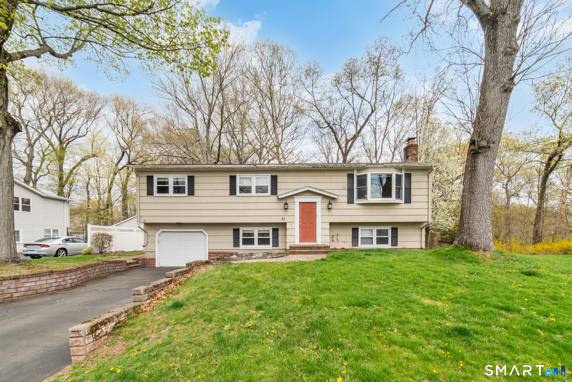 51 Sky View Circle Hamden, CT 06514 - Photo 1 of 40 a house that has tree in front of it