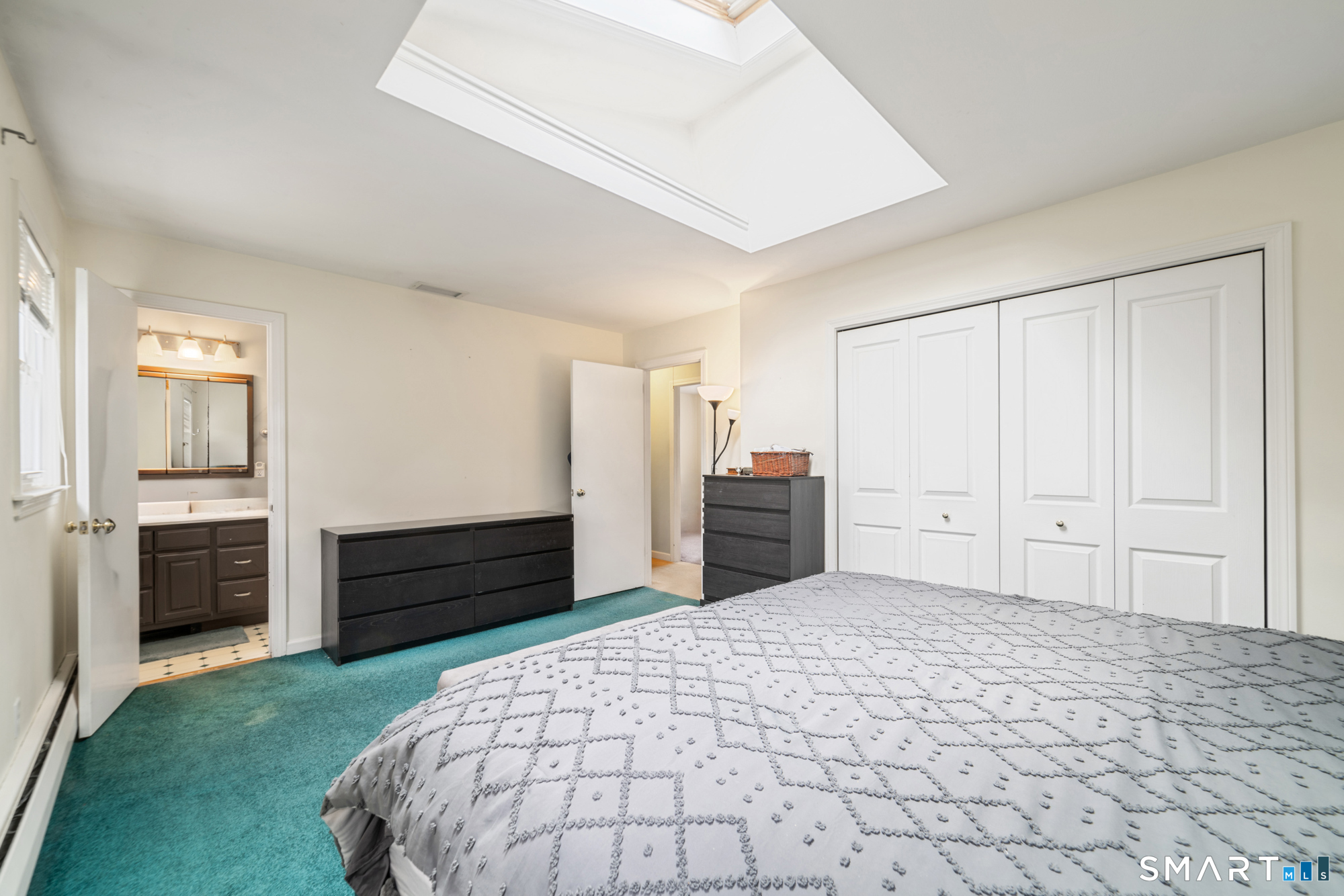 51 Sky View Circle Hamden, CT 06514 - Photo 16 of 40 a bedroom with a bed and cabinets