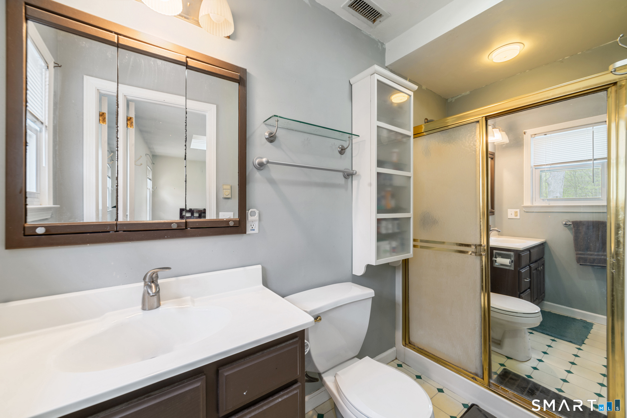 51 Sky View Circle Hamden, CT 06514 - Photo 18 of 40 a bathroom with a sink a toilet a mirror and shower