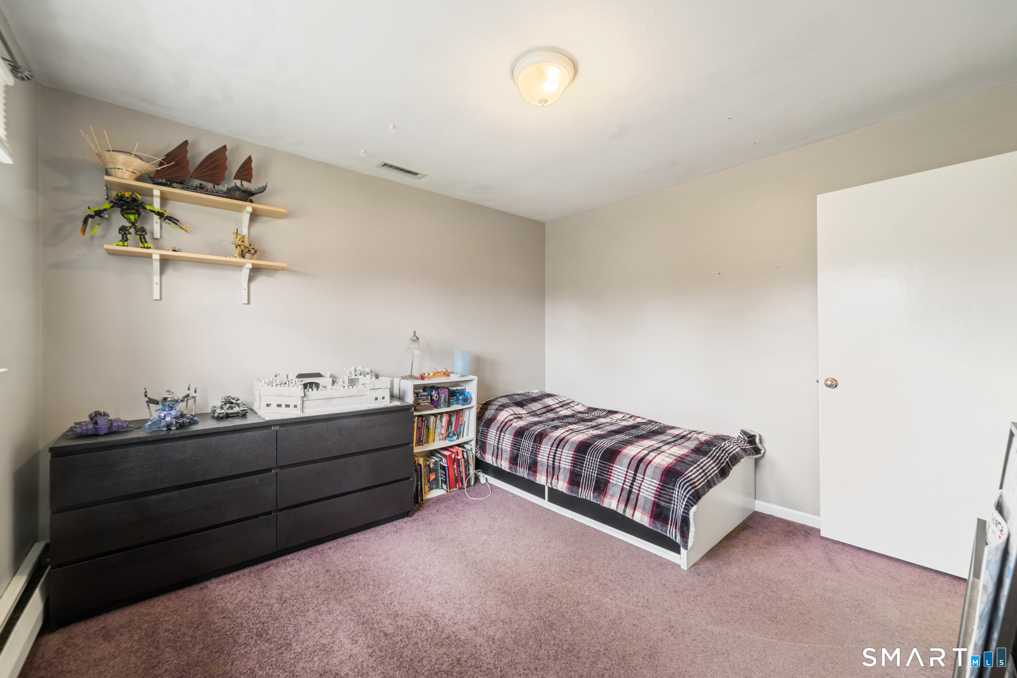 51 Sky View Circle Hamden, CT 06514 - Photo 21 of 40 a living room with a bed furniture and a window