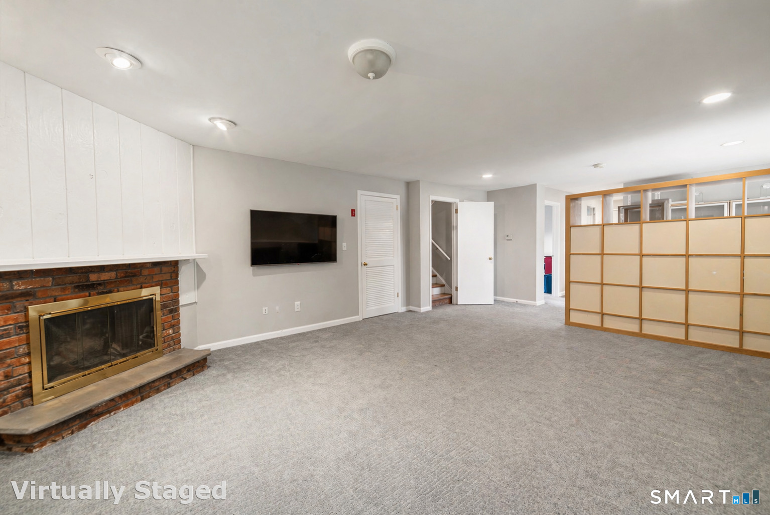 51 Sky View Circle Hamden, CT 06514 - Photo 25 of 40 a view of a livingroom with an empty space and a fireplace
