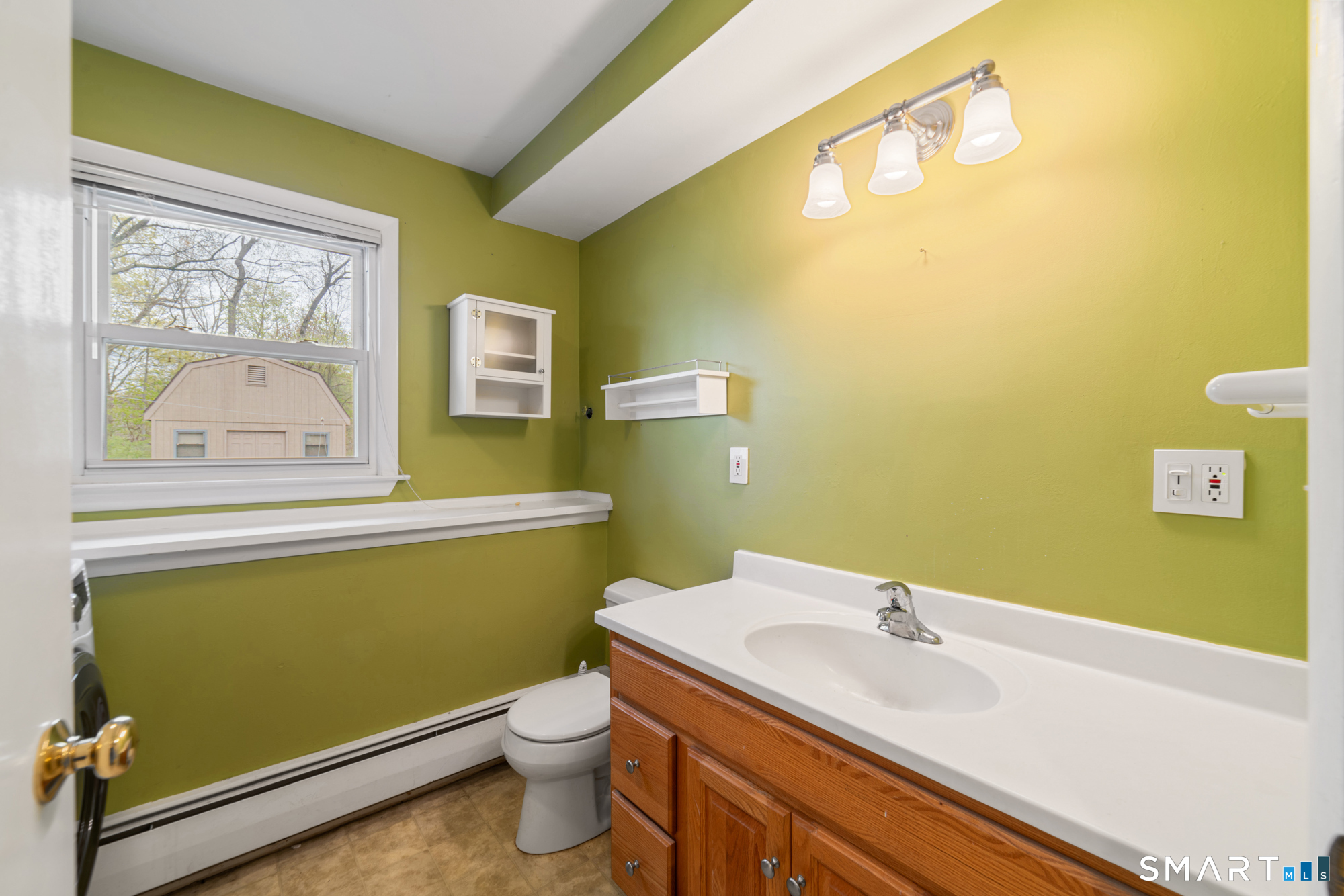 51 Sky View Circle Hamden, CT 06514 - Photo 33 of 40 a bathroom with a sink and a toilet