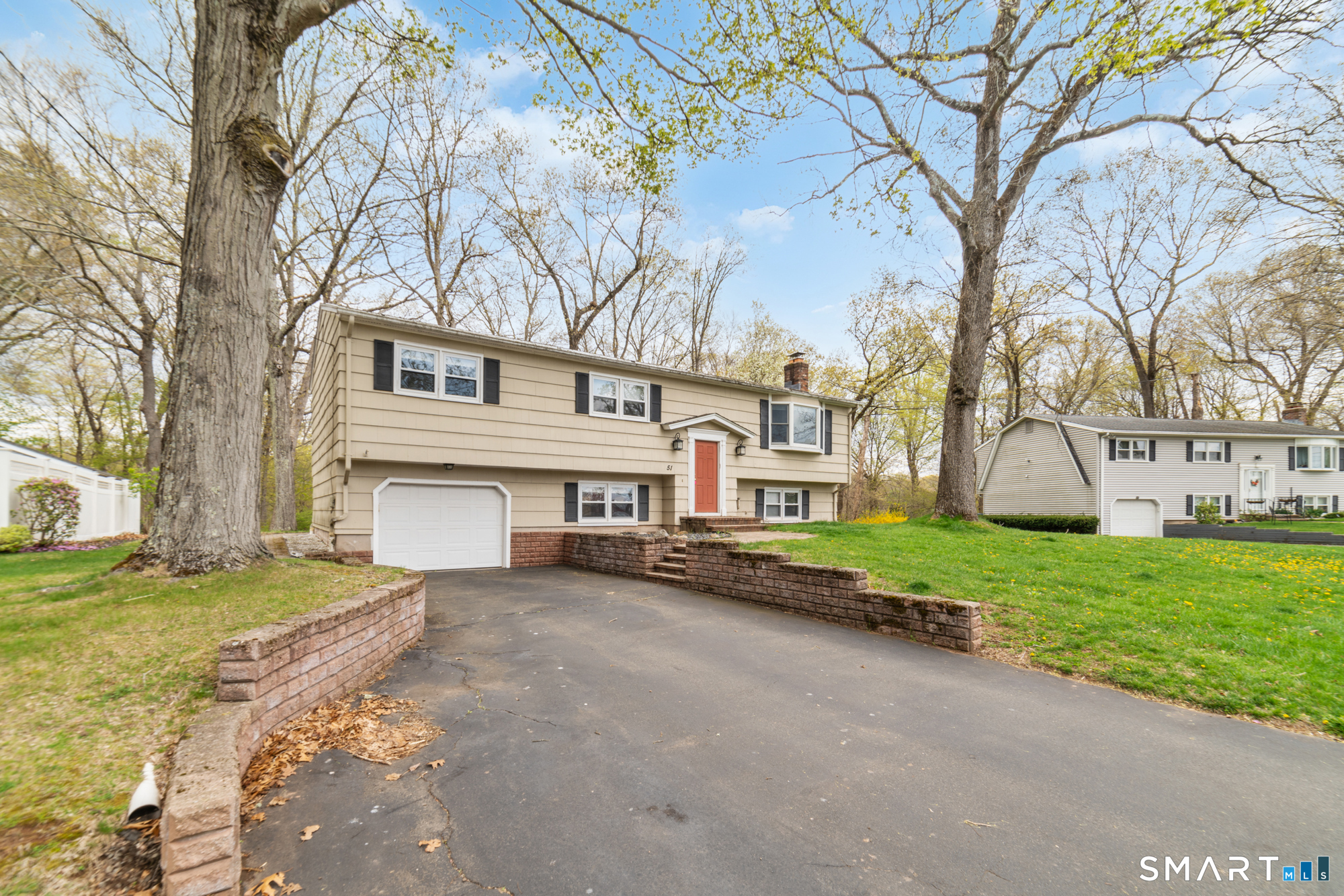51 Sky View Circle Hamden, CT 06514 - Photo 36 of 40 a view of a house with a yard and large trees