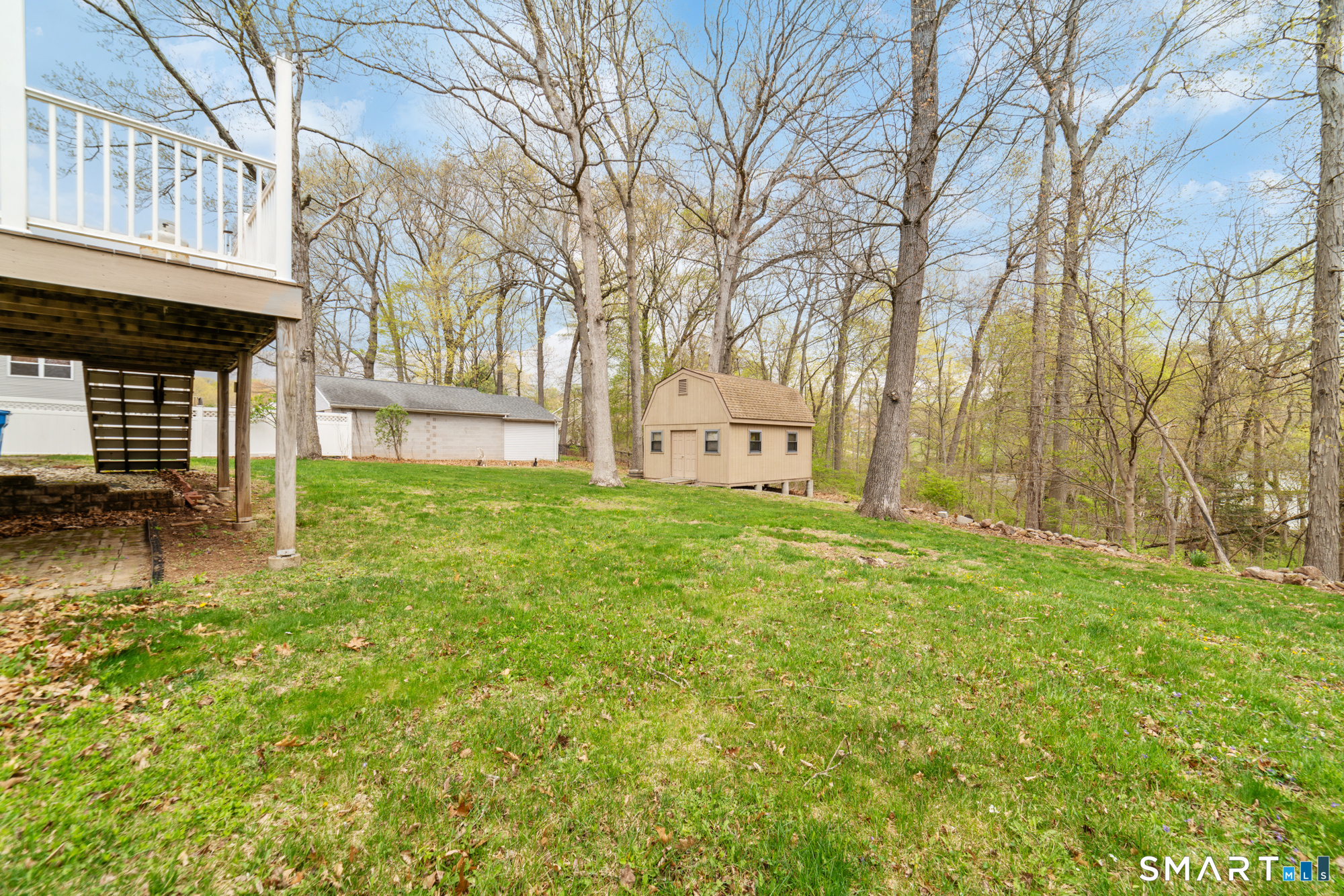 51 Sky View Circle Hamden, CT 06514 - Photo 38 of 40 a view of a backyard with large trees