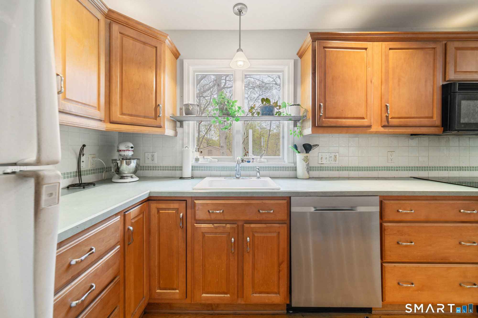 51 Sky View Circle Hamden, CT 06514 - Photo 5 of 40 a kitchen with stainless steel appliances granite countertop white cabinets and a window
