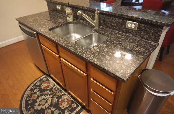 a kitchen with a sink and a stove