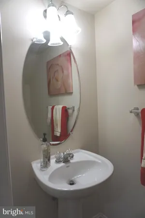a bathroom with a sink vanity and mirror