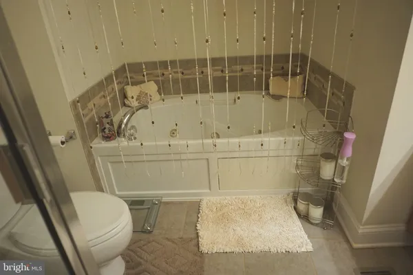 a bathroom with a toilet and shower